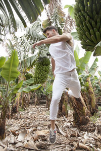 Man standing amidst trees