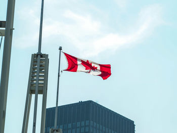 Low angle view of flag against sky