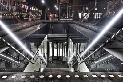 High angle view of illuminated escalator in building