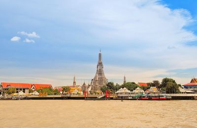 Big pagoda on the river bank at bangkok thailanf