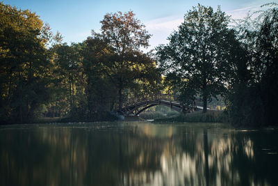 Arch bridge over river against sky