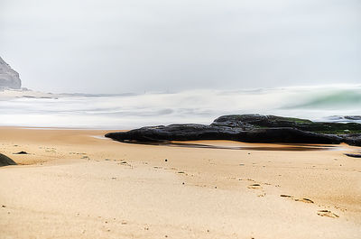 Scenic view of beach against sky