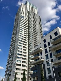 Low angle view of modern buildings against sky