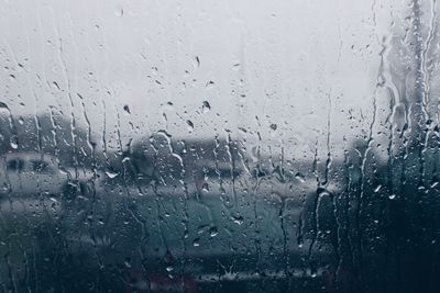 Full frame shot of wet window in rainy season