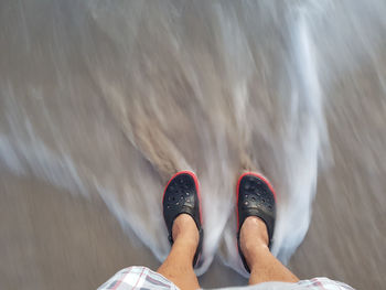 Low section of person in sea