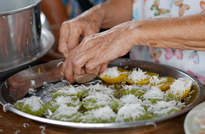 Midsection of man preparing food