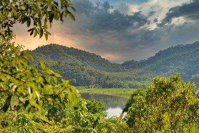 Scenic view of lake and mountains against sky