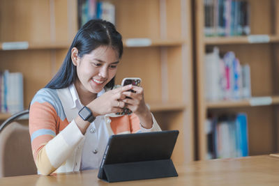 Young woman using mobile phone