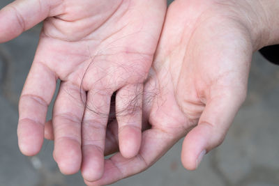 Close-up of hand holding hands