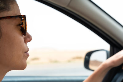 Close-up of man driving car