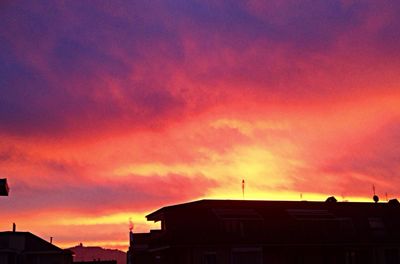 Low angle view of building against cloudy sky