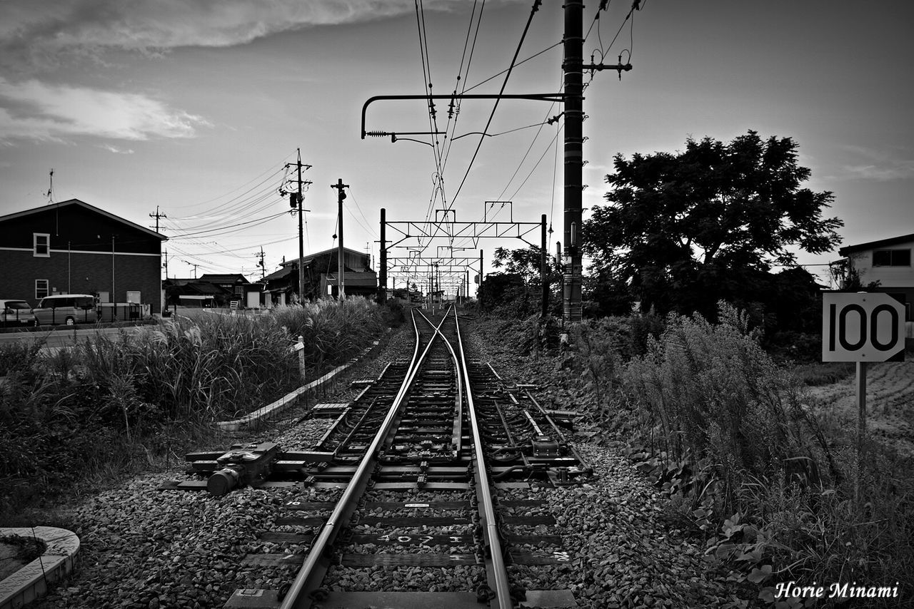 railroad track, rail transportation, transportation, cable, the way forward, electricity pylon, electricity, power line, sky, no people, day, railway track, railway signal, outdoors, built structure, tree, architecture