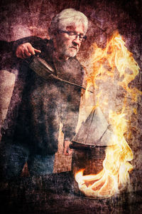 Portrait of man with fire crackers
