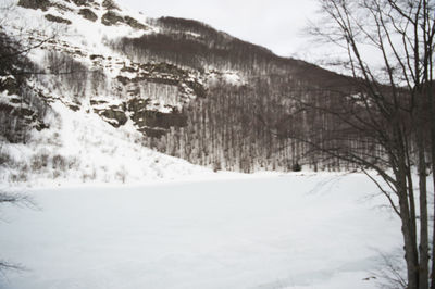 Scenic view of snow covered mountains against sky