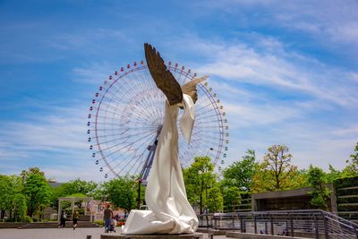 Low angle view of statue against sky