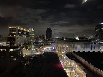 High angle view of illuminated buildings in city at night