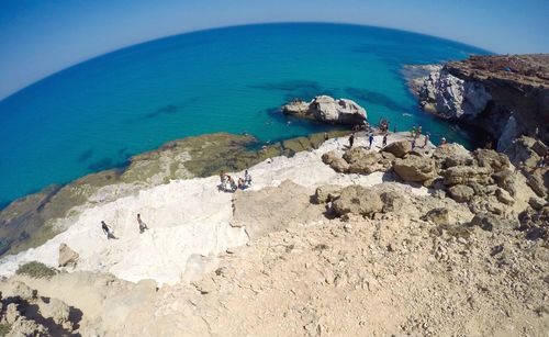 Scenic view of sea against clear blue sky