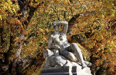 Low angle view of statue against trees