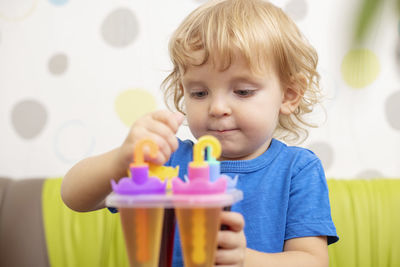 Portrait of cute girl blowing bubbles