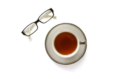 Directly above shot of tea cup against white background