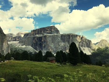 Scenic view of mountains against cloudy sky