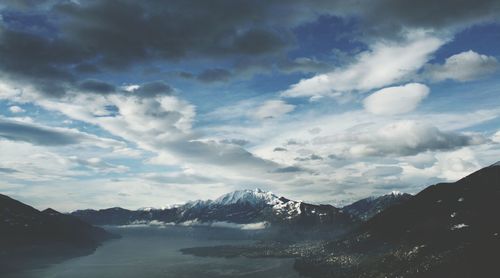 Scenic view of mountains against cloudy sky