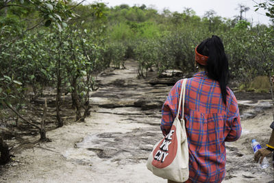 Rear view of woman walking on pathway