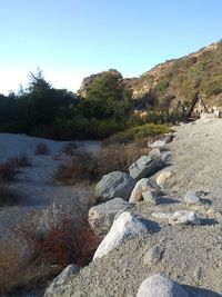 Scenic view of rocks against clear sky