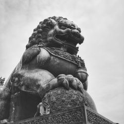 Low angle view of statue against sky