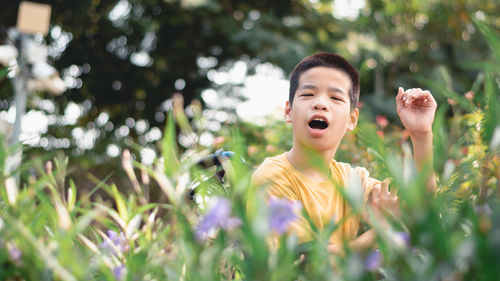 Full length of boy on grassy field