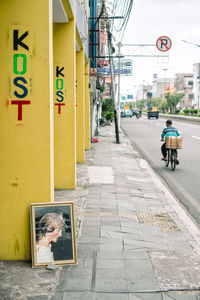 Painting of princess diana on street in city