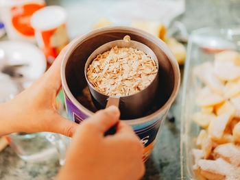 Midsection of woman holding ice cream