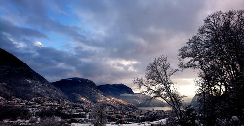 Scenic view of snowcapped mountains against sky during sunset