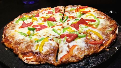 Close-up of pizza served on table