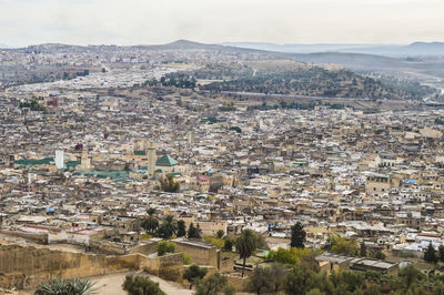 Aerial view of cityscape against sky