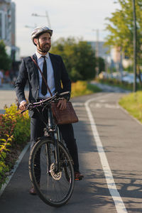 Man riding bicycle on road