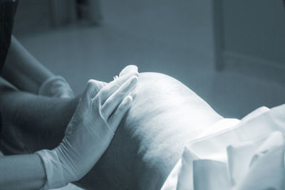 Doctor giving treatment to patient at hospital