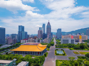 High angle view of buildings in city against sky