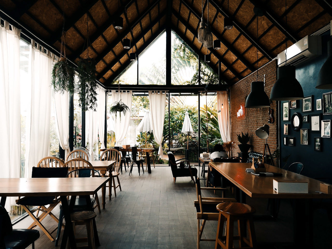 seat, chair, indoors, table, furniture, absence, restaurant, window, business, ceiling, empty, no people, day, architecture, built structure, glass - material, wood - material, arrangement, lighting equipment, food and drink, setting, cafeteria