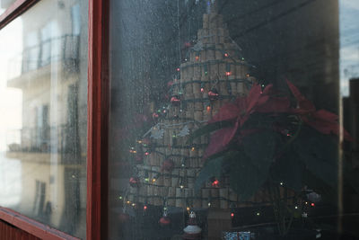 Buildings seen through wet glass window