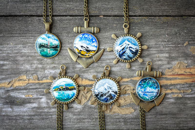 Close up pendants with miniature landscapes concept photo