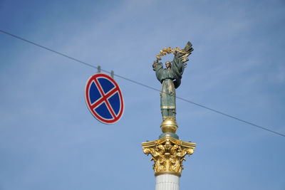 Low angle view of statue against sky