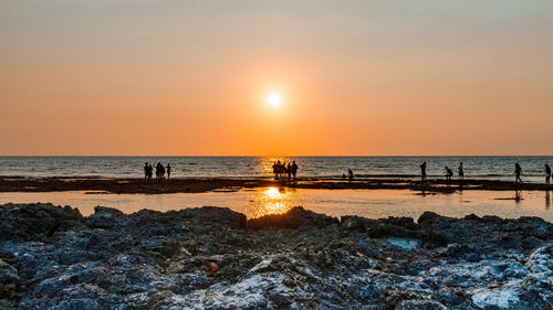 Scenic view of beach during sunset