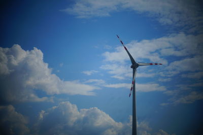 Low angle view of wind turbine against sky