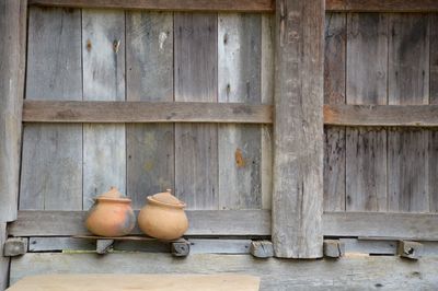 Close-up of vase against wall