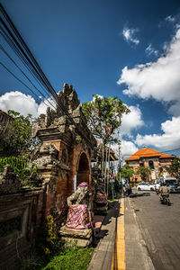 Man against built structure against sky