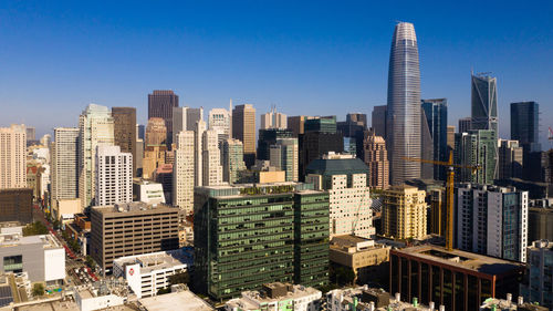 Modern buildings in city against sky