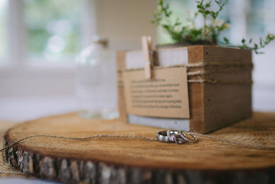 Wedding rings on top of wood round