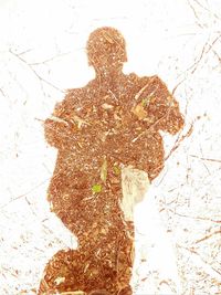 Digital composite image of woman standing against white background