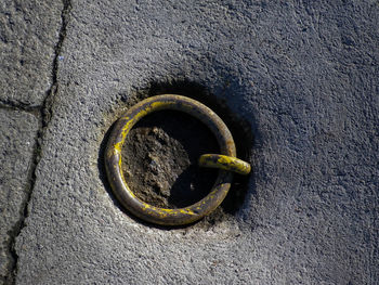 High angle view of rusty metal on wall